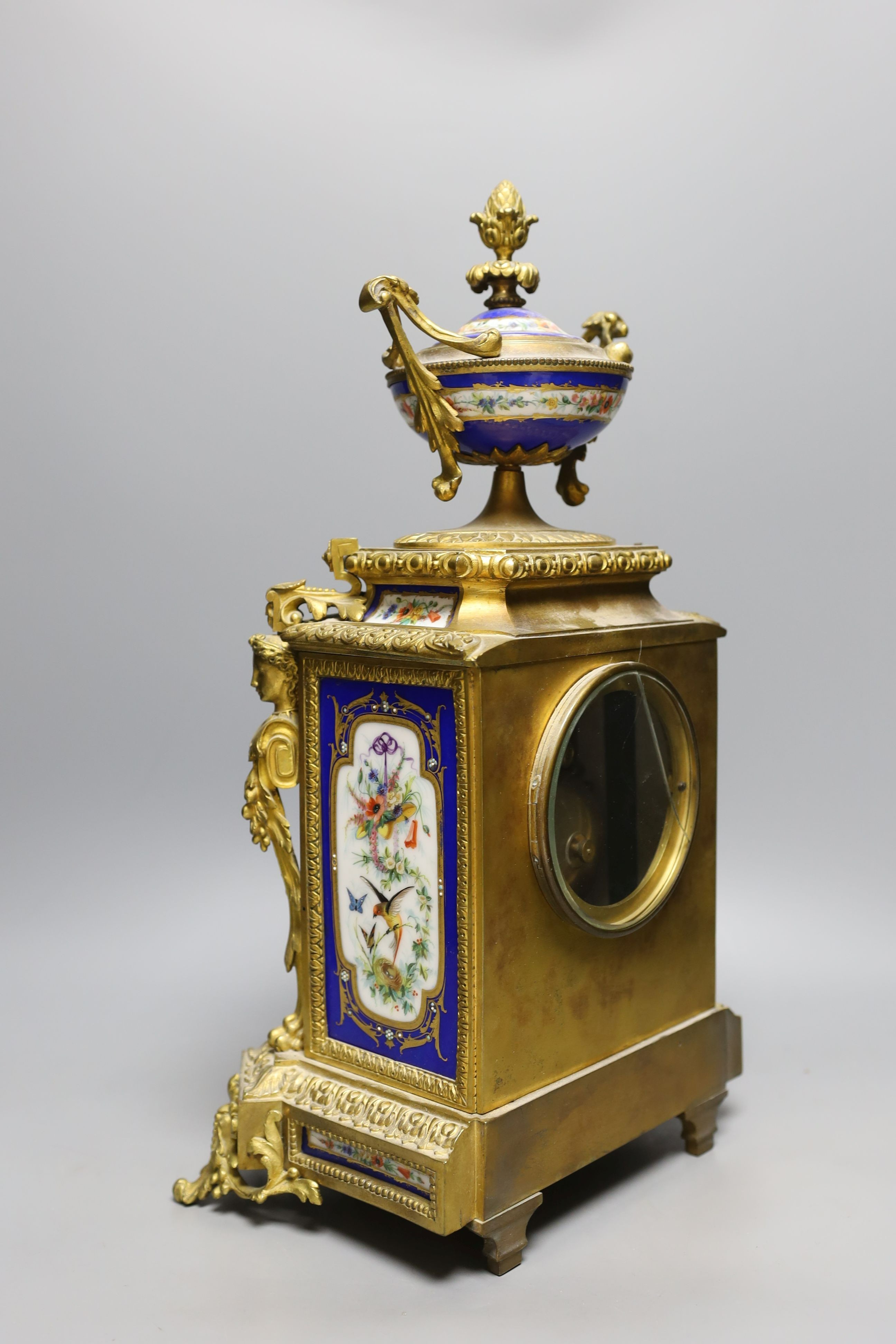 A late 19th century Sevres style porcelain and ormolu mounted mantel clock 42cm